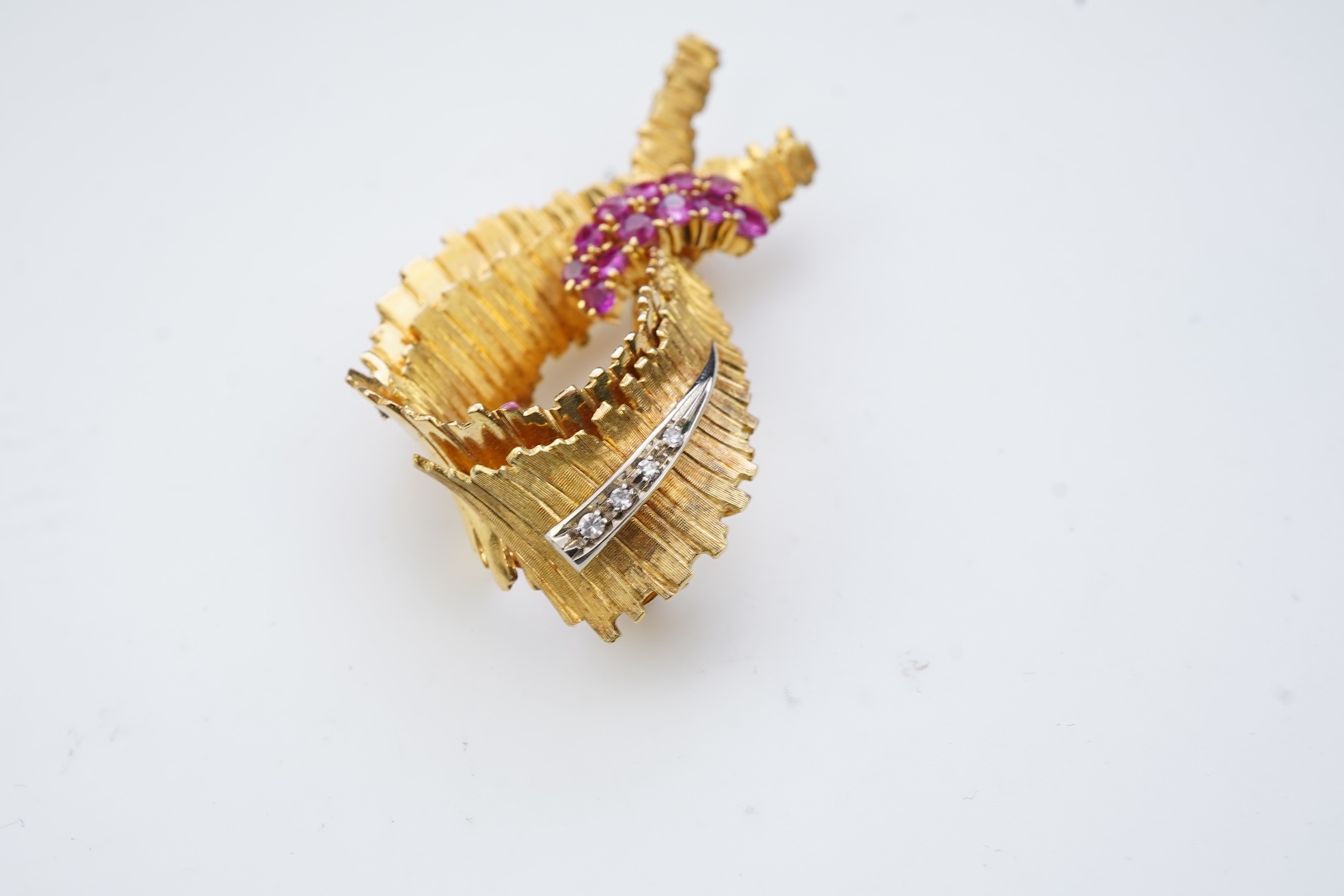 A gold, ruby and diamond brooch, circa 1965